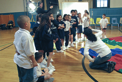 Film director, Yasmina Cadiz working on location with kids for the final scene of Mama Said.